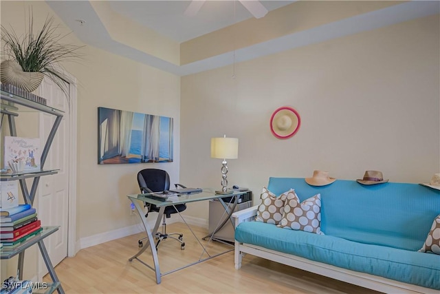 home office featuring wood finished floors and baseboards