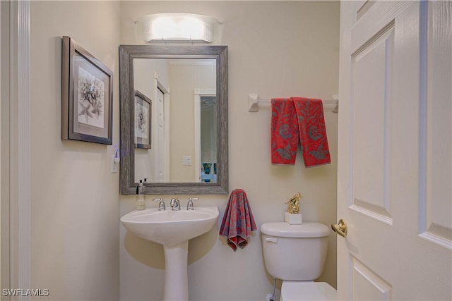 bathroom with a sink and toilet