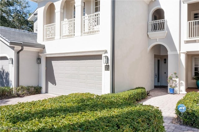 property entrance with stucco siding