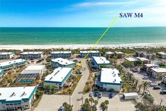 bird's eye view with a view of the beach and a water view