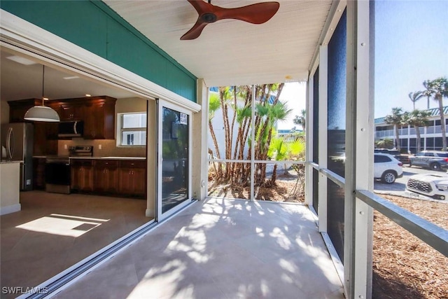 sunroom / solarium with ceiling fan