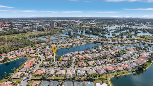 birds eye view of property featuring a water view and a residential view