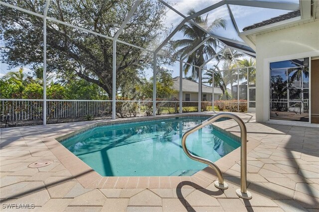 view of pool with a lanai and a patio area