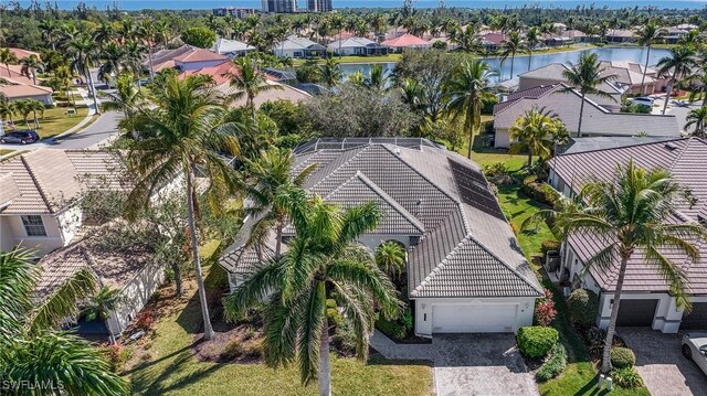 bird's eye view with a residential view and a water view