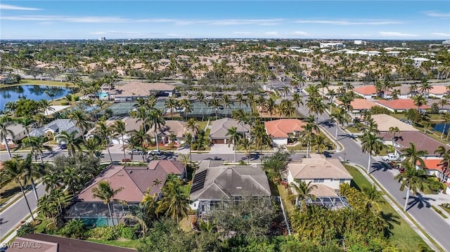 bird's eye view featuring a residential view and a water view