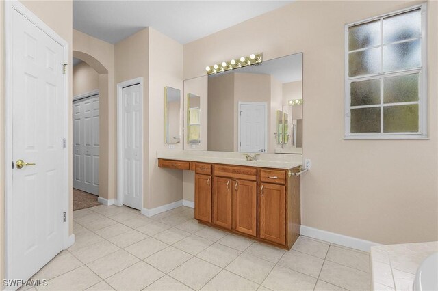 bathroom featuring tile patterned floors and vanity