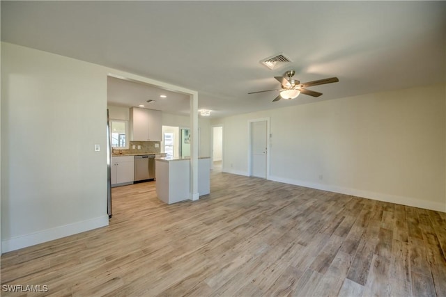 unfurnished living room with ceiling fan and light wood-type flooring