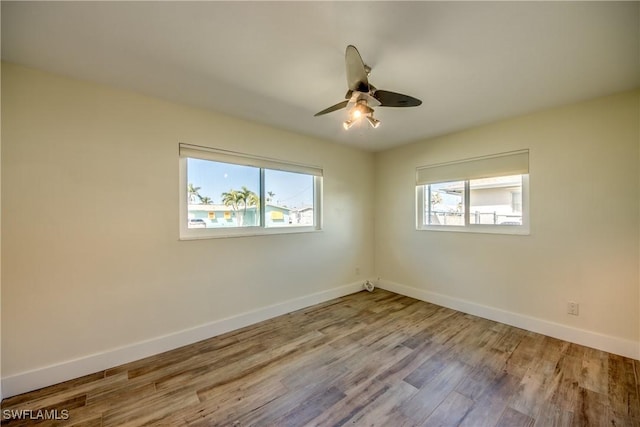 empty room featuring ceiling fan and light wood-type flooring