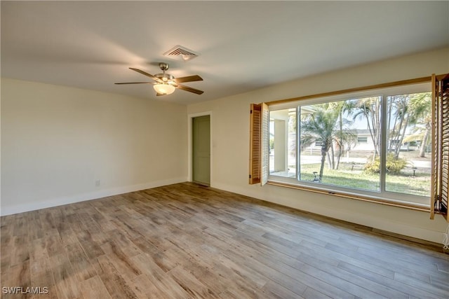 unfurnished room featuring light hardwood / wood-style floors and ceiling fan