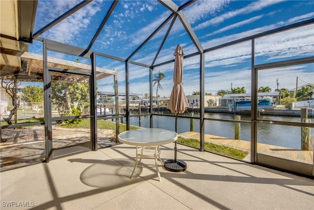 unfurnished sunroom with a healthy amount of sunlight and a water view