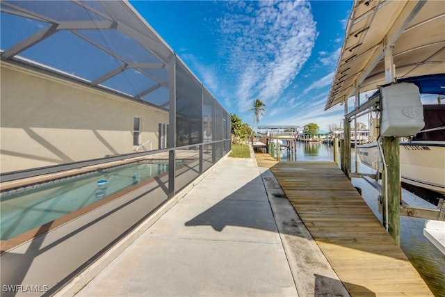 exterior space featuring a water view and a lanai