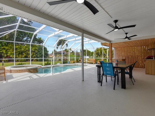 view of pool with an in ground hot tub, a lanai, ceiling fan, and a patio