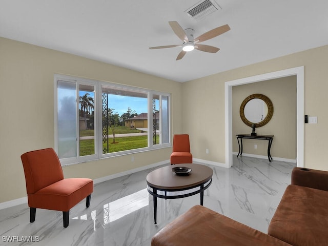 sitting room with ceiling fan