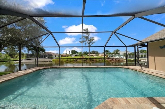 view of swimming pool featuring a water view, a lanai, and a patio