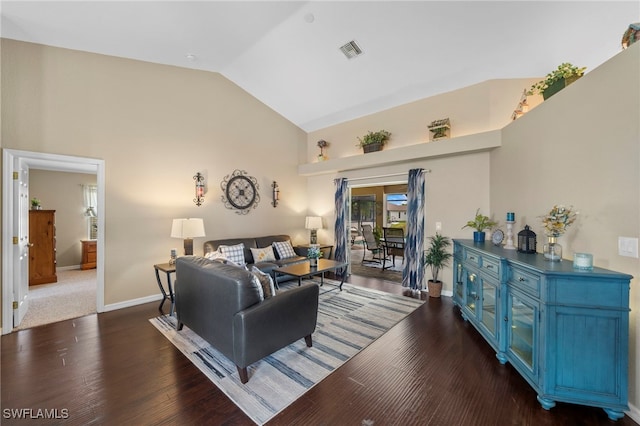 living room with dark hardwood / wood-style floors and vaulted ceiling