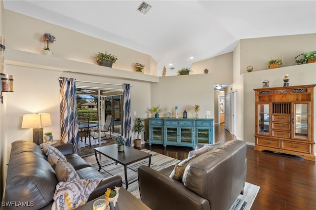 living room featuring lofted ceiling and dark hardwood / wood-style floors