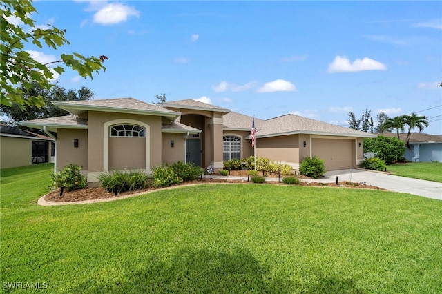 view of front of property with a garage and a front lawn