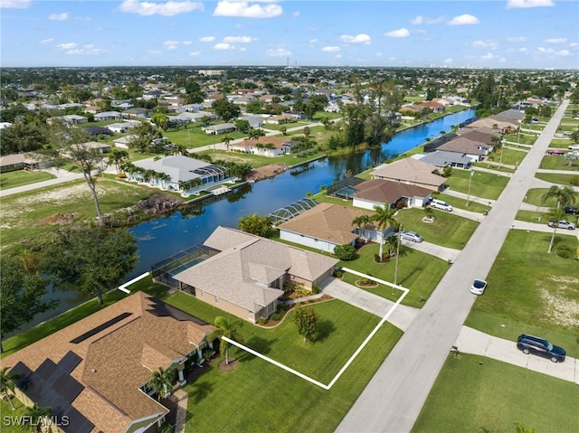 drone / aerial view with a water view