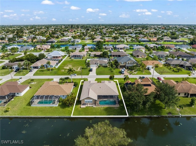 drone / aerial view with a water view