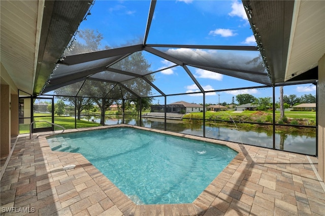 view of swimming pool with a water view, a patio, and glass enclosure