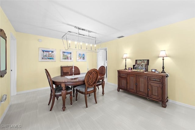 dining room with a chandelier