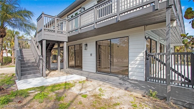 exterior space featuring a wooden deck and a patio area