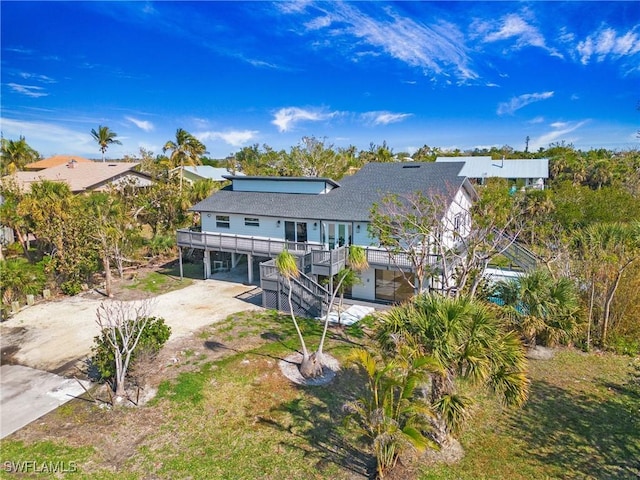 back of property featuring a carport