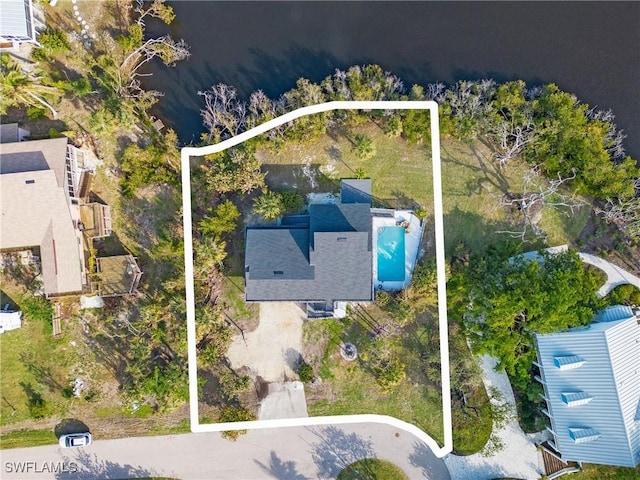 birds eye view of property with a water view