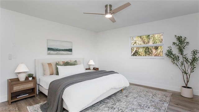 bedroom with hardwood / wood-style flooring and ceiling fan