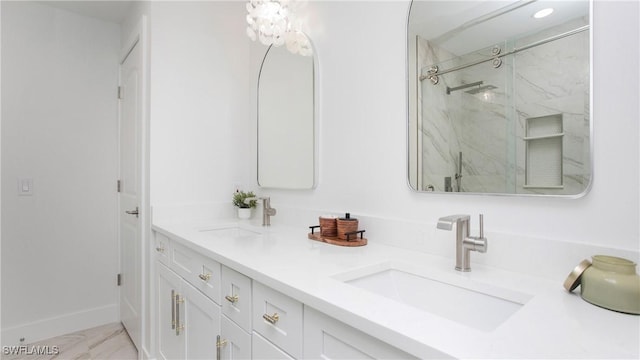 bathroom with walk in shower and vanity