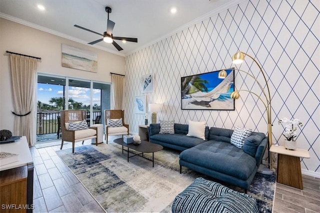 living room featuring crown molding and ceiling fan