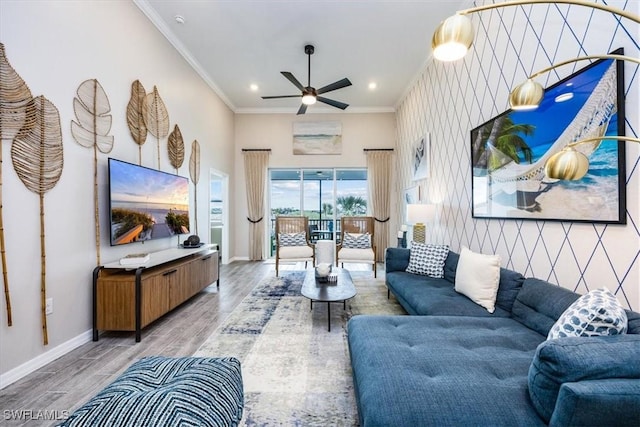 living room featuring crown molding, ceiling fan, and hardwood / wood-style flooring