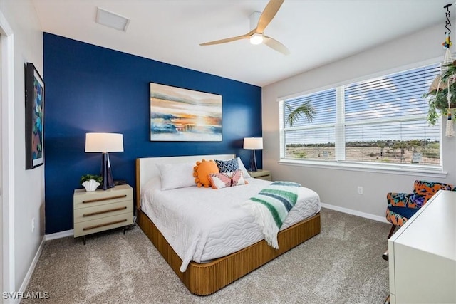 bedroom featuring ceiling fan and carpet