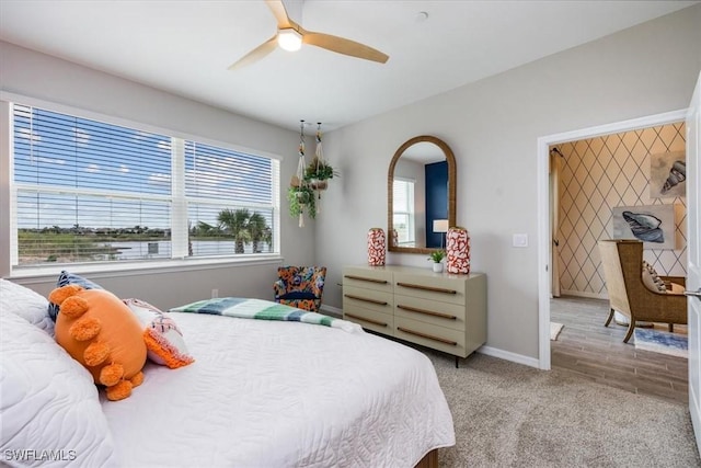 carpeted bedroom with ceiling fan