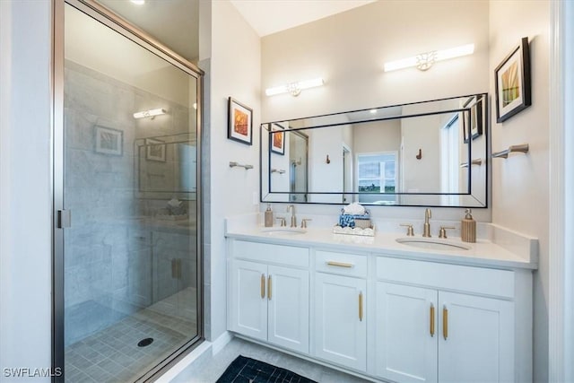 bathroom featuring vanity and an enclosed shower