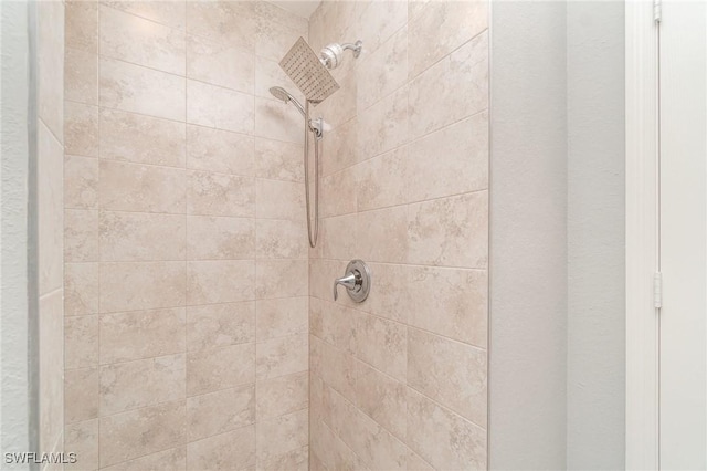 interior details with a tile shower