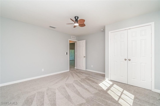 unfurnished bedroom with baseboards, visible vents, and carpet flooring