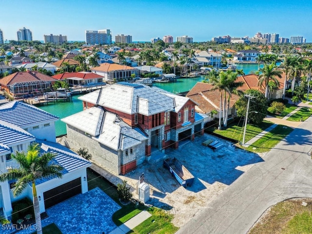 birds eye view of property featuring a water view