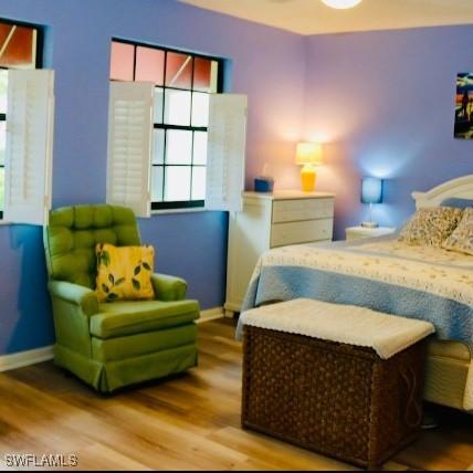 bedroom with hardwood / wood-style floors