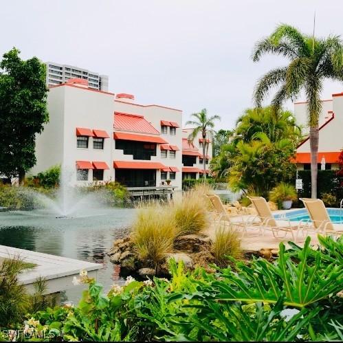 view of home's community with a water view