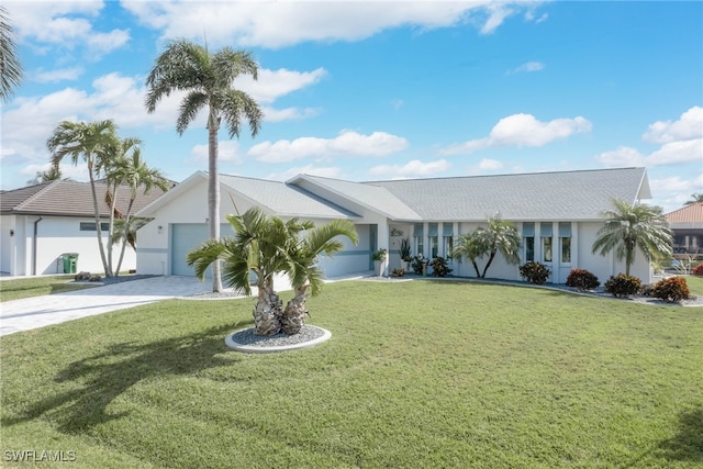 ranch-style house with a garage and a front yard