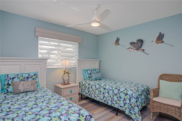 bedroom with ceiling fan and light hardwood / wood-style floors