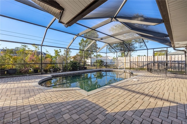 view of pool featuring a lanai and a patio