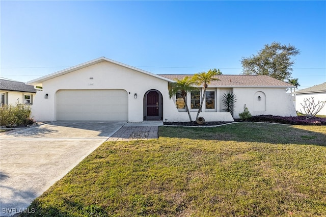 single story home with a garage and a front lawn