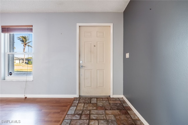 entryway featuring a textured ceiling