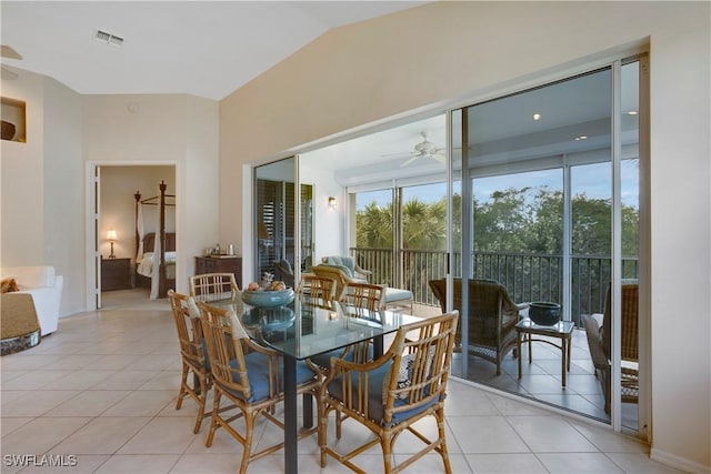 dining room with lofted ceiling, light tile patterned floors, ceiling fan, and visible vents