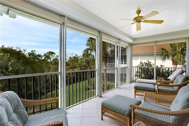 sunroom featuring a ceiling fan