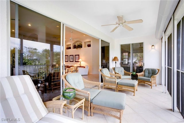 sunroom with ceiling fan