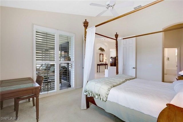 bedroom featuring visible vents, ceiling fan, light carpet, and ensuite bathroom