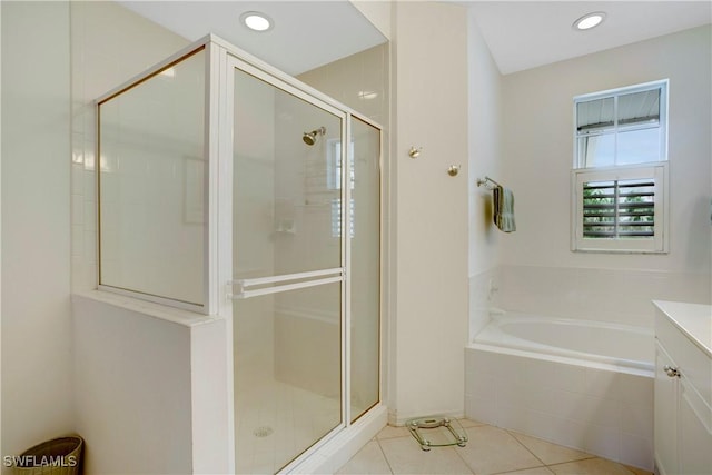 full bathroom with tile patterned flooring, vanity, a shower stall, a bath, and recessed lighting